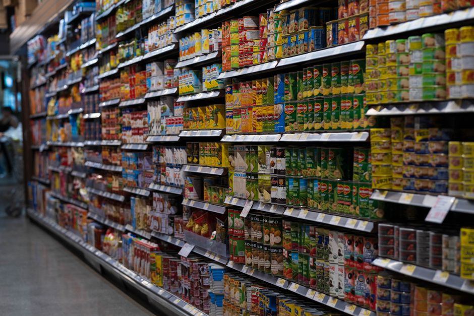 Supermarket aisle stocked with packaged goods