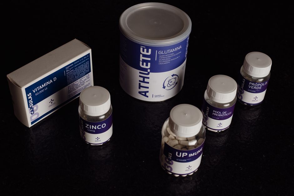 Supplement bottles lined up on a surface
